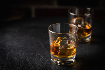 Whiskey with ice in glasses