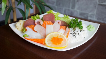 Sashimi Sushii Set with different kinds of fish like tuna and salmon.