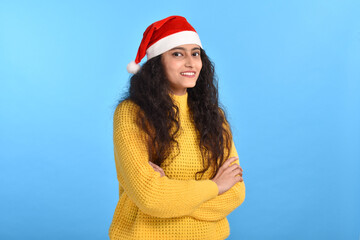 Happy young woman wearing cap of santa 