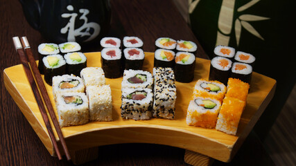 Uramaki and maki Sushi Set with different kinds of fish like tuna and salmon.