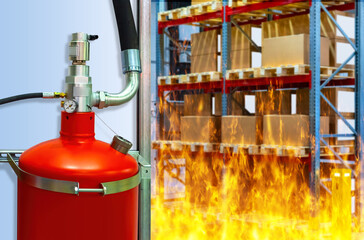 Fire-fighting equipment. Stationary fire extinguisher on wall of warehouse. Burning racks with...