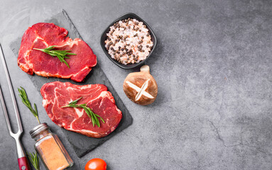 Fresh beef steak on a concrete background