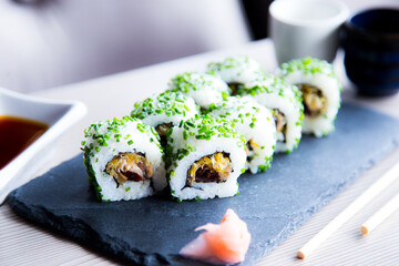 Vegan uramaki. Type of sushi covered with rice on the outside and filled with a combination of vegetables.