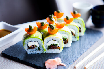 Vegan uramaki. Type of sushi covered with rice on the outside and filled with a combination of vegetables.