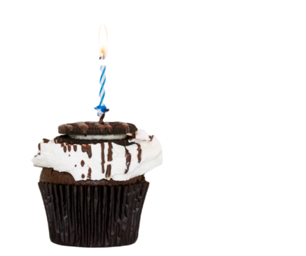 Brown cupcake with marshmello frosting and a cookie with a blue lit candle on top and a transparent background