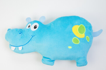 Plush blue hippopotamus. Soft toy for children on a white background.
