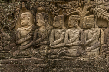 Bayon temple bas-relief of five seated men, Angkor Wat; Siem Reap, Siem Reap Province, Cambodia