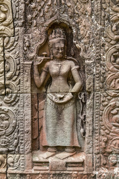 Bas-relief figure on wall with carved patterns, Ta Som, Angkor Wat; Siem Reap, Siem Reap Province, Cambodia
