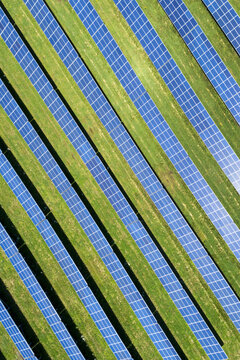 Aerial view looking straight down of a solar farm with sun reflecting off the panels, West of Dunville; Ontario, Canada