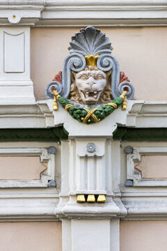 Close-up of colourful decorative lion motif on building wall; Trier, Germany