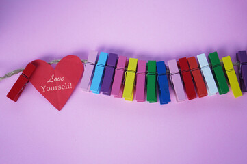 Self love and care concept with inspirational motivational text on red heart - Love Yourself. On...