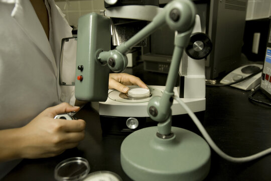Scientist performing a bacteria count, Membrane filtration method, laboratory