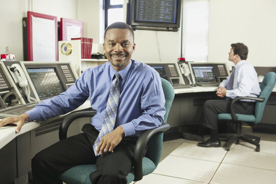 Two operating engineers in a control room