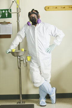 Scientist standing at an eye wash station