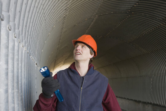 Engineer inspecting a tunnel