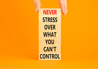 Never stress symbol. Concept words Never stress what you can not control on wooden blocks....