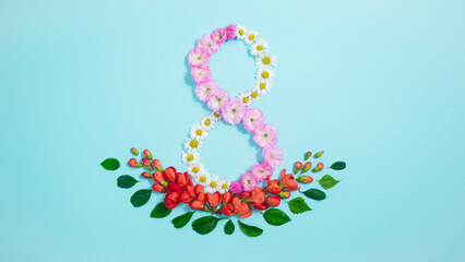 Greeting card for Women's Day on March 8, made from fresh natural flower white, pink and red buds and leaves. Blue background.