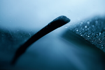 Close up of windshield wiper in rain - obrazy, fototapety, plakaty