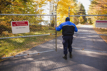 Security guard opening a gate