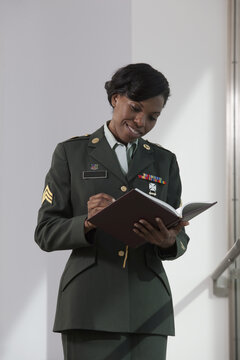 Female doctor of US army writing in a diary