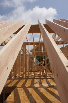 Low angle view of roof rafters of a house