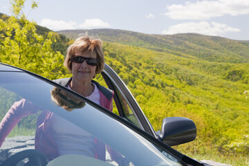 Woman coming out from a car