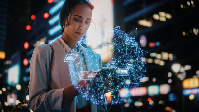 Beautiful Woman Using Smartphone on a City Street at Night. Businesswoman Using Mobile Phone, Infographics Show Productivity, Economics, e-Commerce, Finance, Statistics Graphs, Stock Market Data - Powered by Adobe