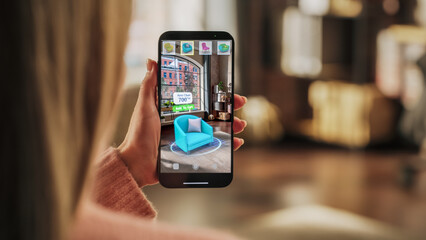 Decorating Apartment: Woman Holding Smartphone, using Augmented Reality Interior Design Software...