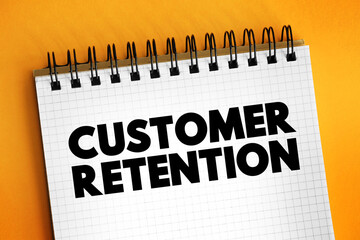 Customer Retention - ability of a company or product to retain its customers over some specified period, text concept on notepad - obrazy, fototapety, plakaty