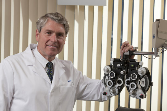 An optometrist with equipment in the office