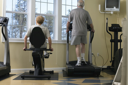 Senior couple exercising in the gym.