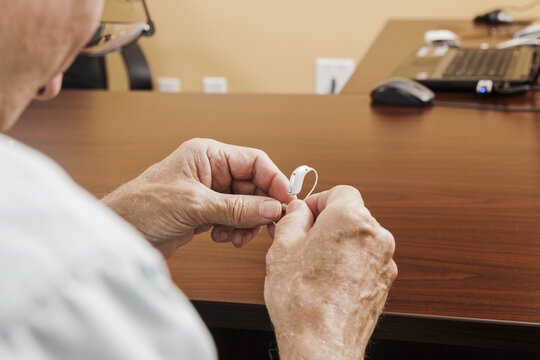 Patient adjusting behind-the-ear hearing aid