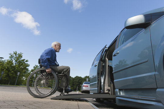 Man with muscular dystrophy and diabetes getting in an accessible van