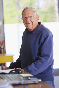 Senior man working in a warehouse
