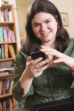 Woman with Asperger syndrome working with her smart phone