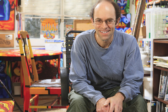Portrait of an artist with Asperger's in his studio