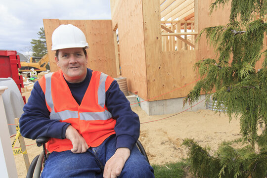 Construction engineer with spinal cord injury at new construction site