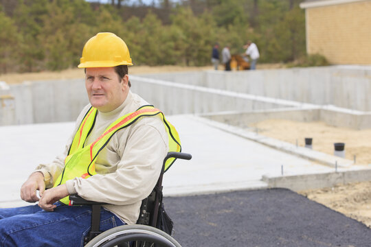 Construction supervisor with Spinal Cord Injury on construction site