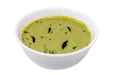 Traditional authentic popular south indian breakfast side dish coconut coriander chutney seasoned with mustard, red dry chilli and curry leaves