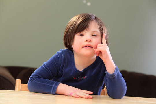 Little girl with Down Syndrome talking