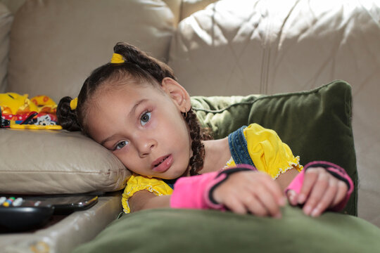 Little girl with Cerebral Palsy sitting at home