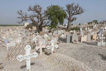 Cemetery in Joal-Fadiout village, Senegal, Africa. Shell road. Joal-Fadiout landmark, monument. Joal-Fadiout cemetery. Graves. Senegal landscape, African cemetery	
