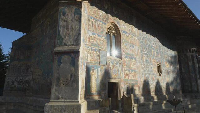 The medieval famous Voronet Monastery in Bukovina, Romania, with its blue painted walls, one of the Painted churches of Moldavia listed as historical and cultural UNESCO's World Heritage Site
