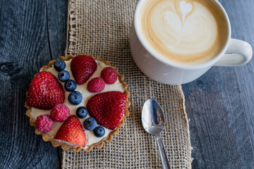 Strawberry Tart with latte on burlap