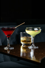 alcoholic cocktails on the stone table in the bar