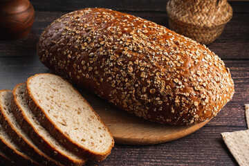 homemade bread with seeds on a wooden background