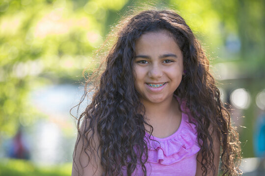 Portrait of happy Hispanic teen girl with braces
