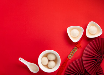 Chinese Lunar New Year Concept. Sweet Rice Dumplings Balls Tangyuan on Red Table