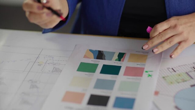 Interior design studio. Designer select solutions and combinations of color palette for the interior blueprint
