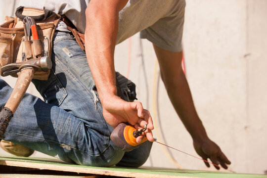 Carpenter using a snap line